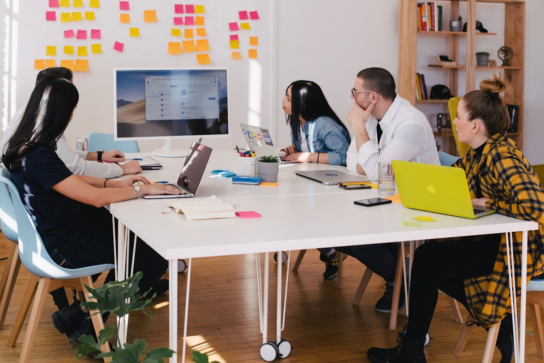 A_team_in_an_office_discussing_how_to_manage_sales_bookings_during_a_meeting.jpeg